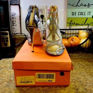 Beautiful crystal embroidered heels. Wore once and are in great condition.